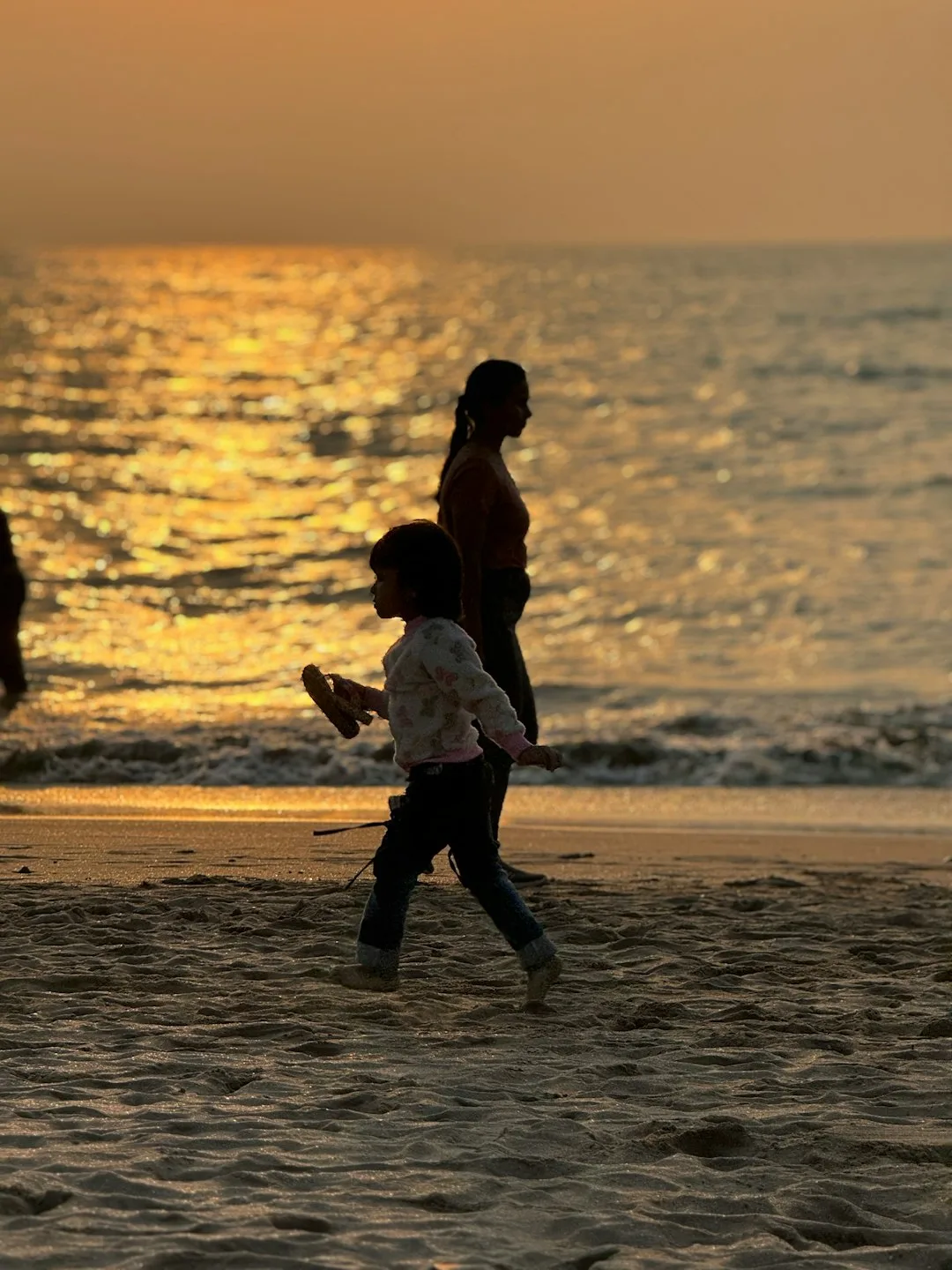A family excitedly packing their bags for a holiday.